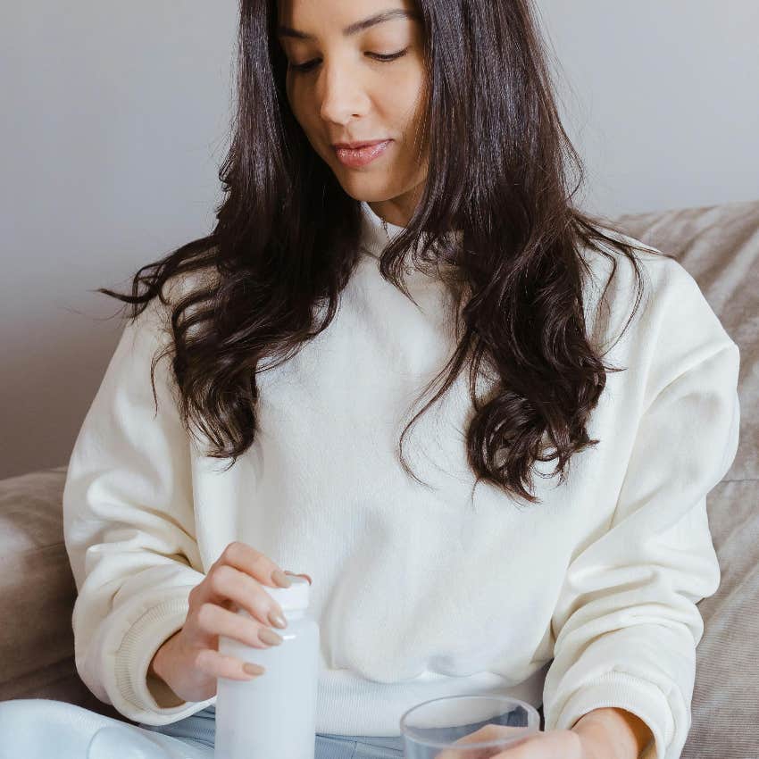 woman taking the prescriptions she paid less for without insurance