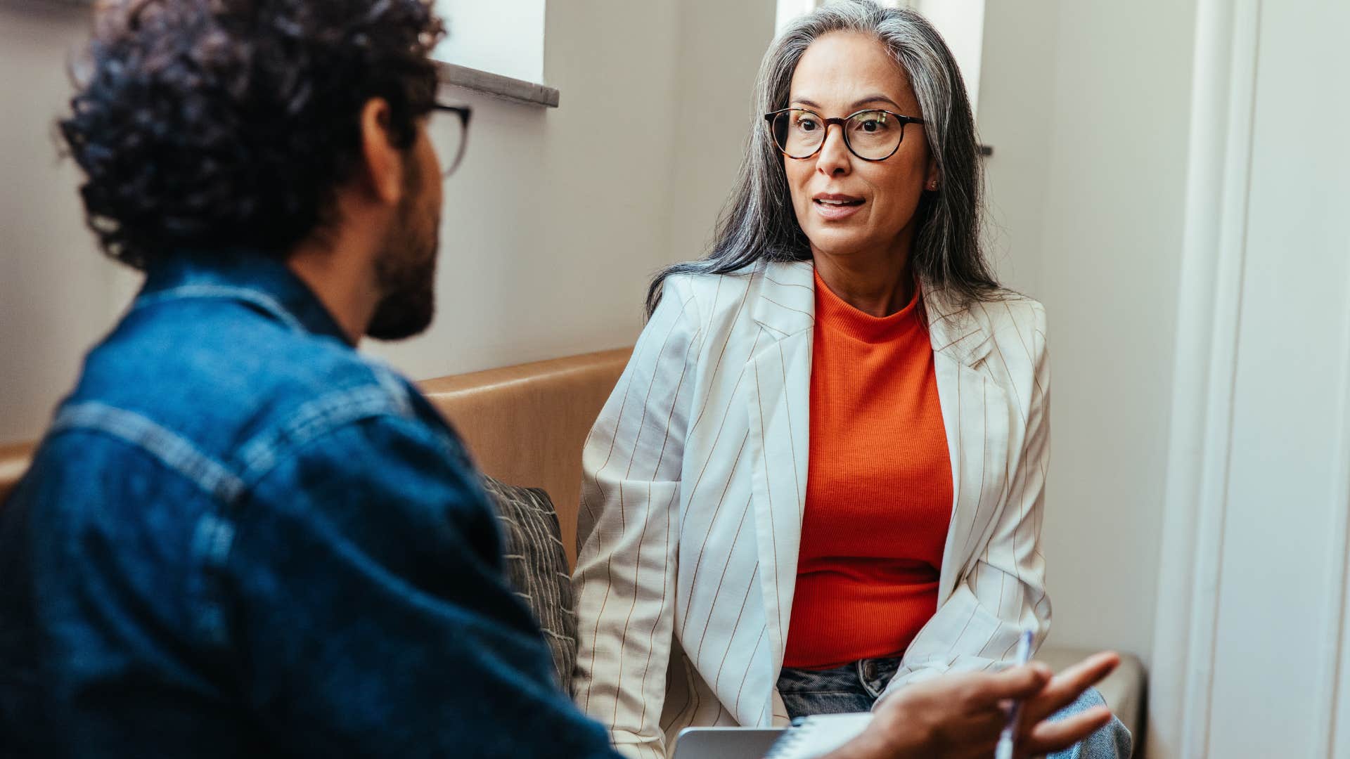 woman with basic good human manners listening intently at work