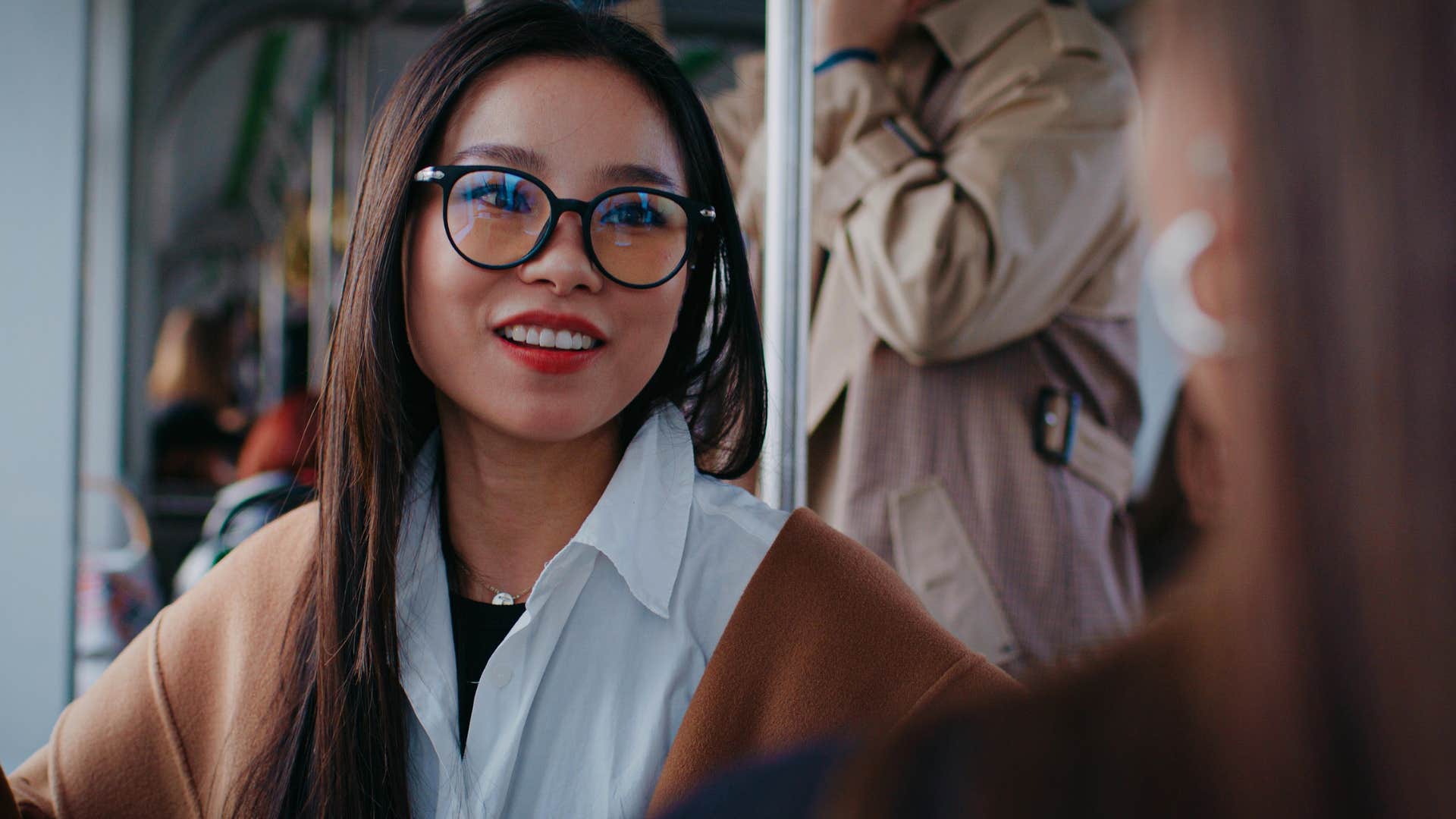 woman practicing good manners listening to friend talk without being on her phone