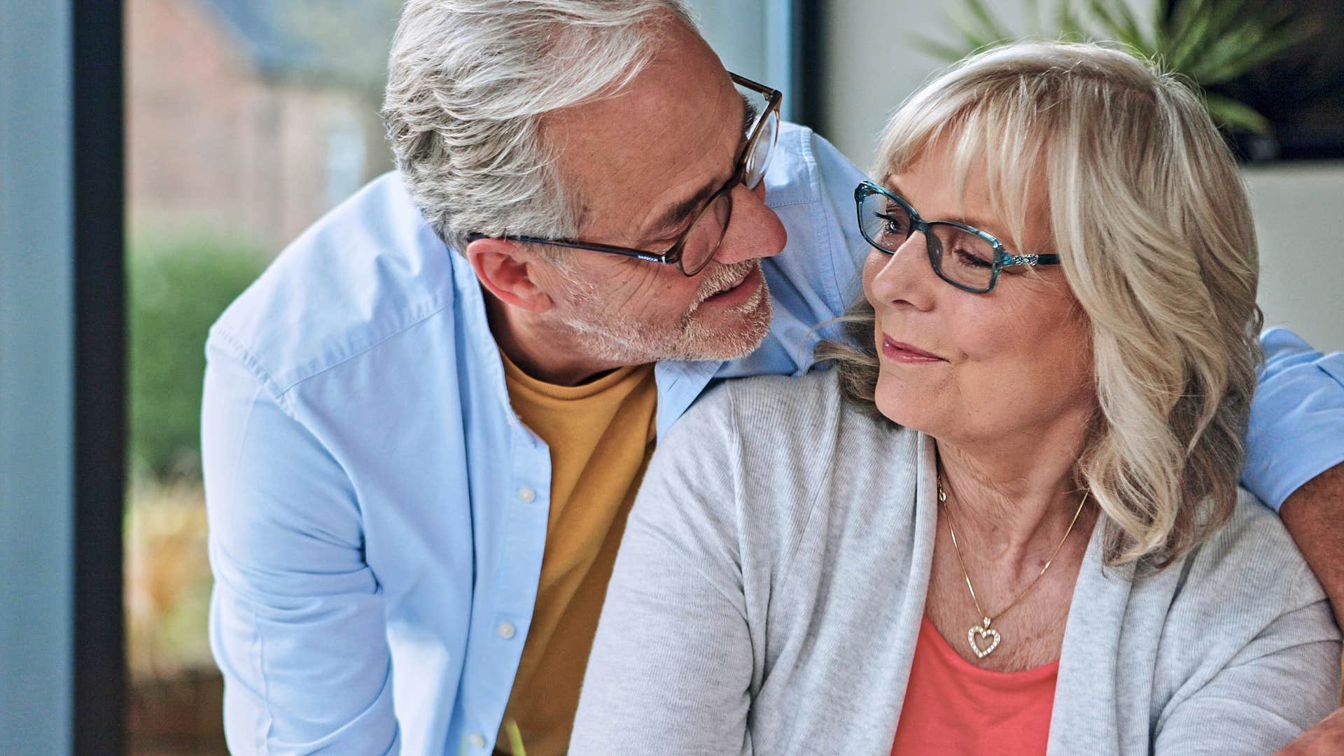 older couple husband expressing gratitude to his wife