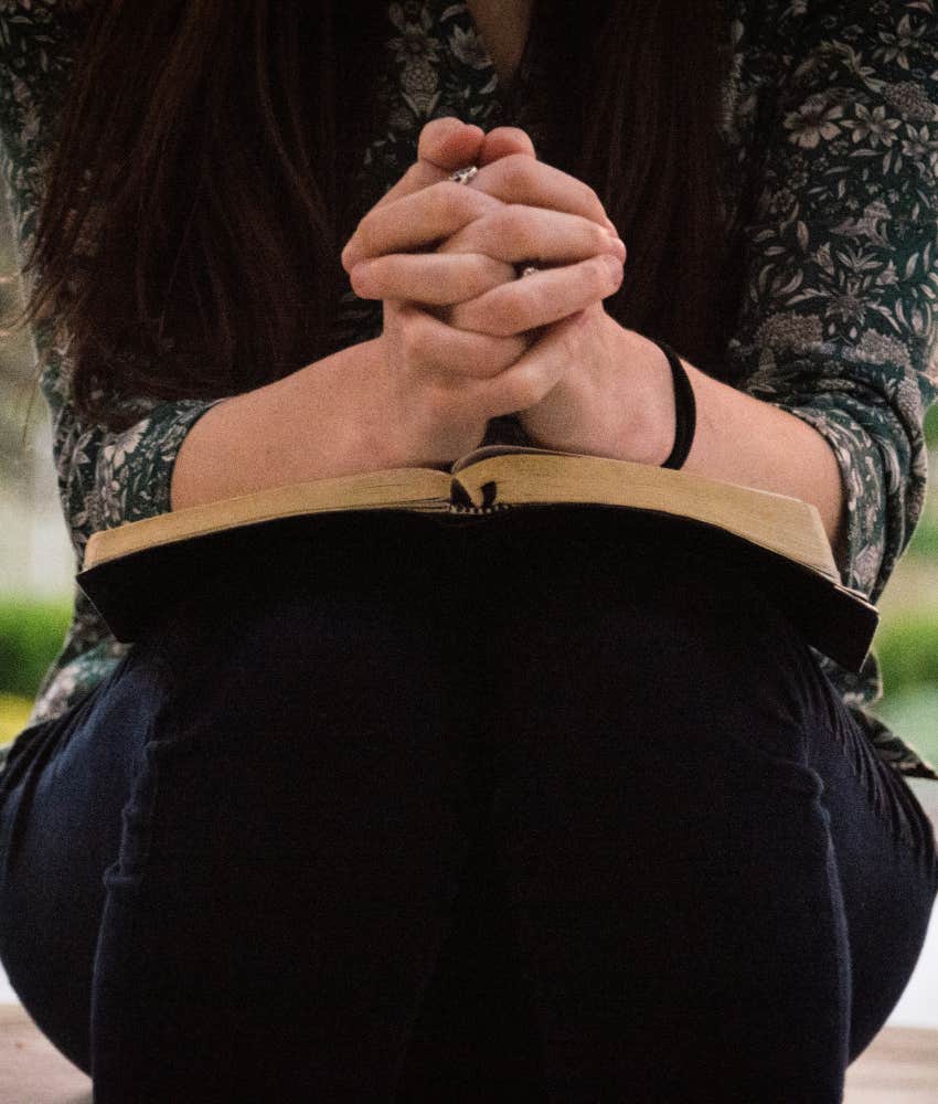 faithful person with book showing faith as red flag