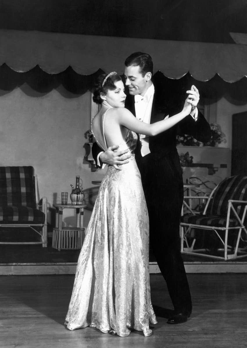 black and white couple dancing in ballroom
