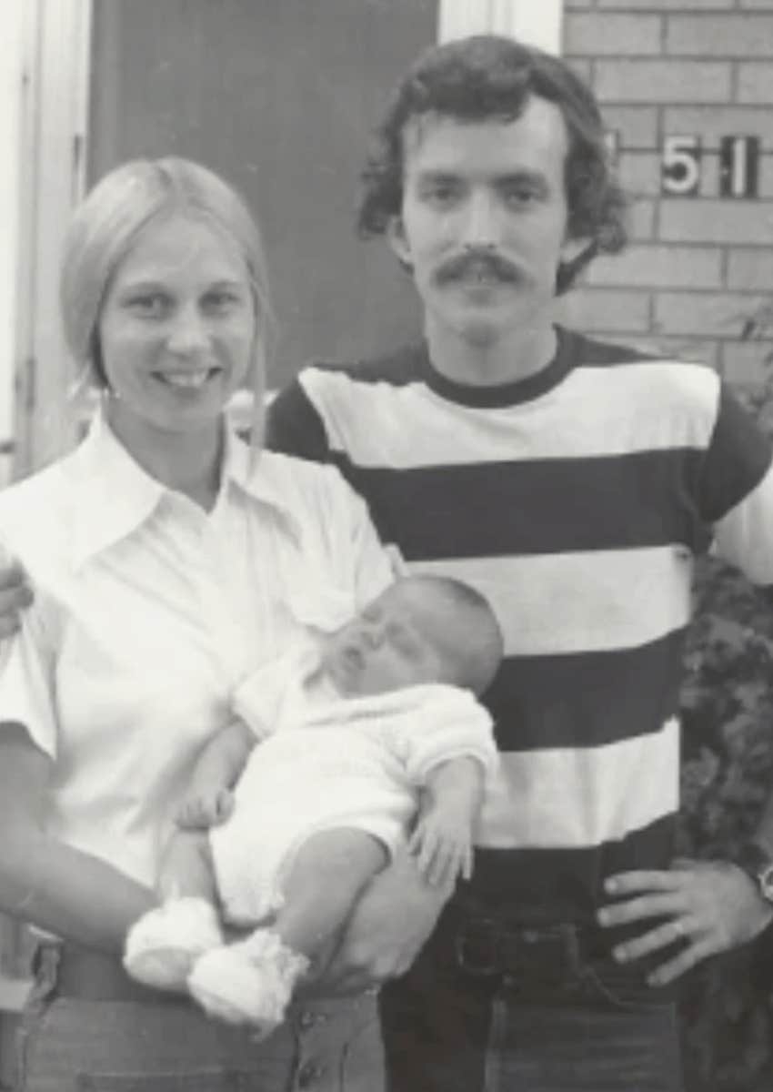 black and white photo of author as a newborn with her parents
