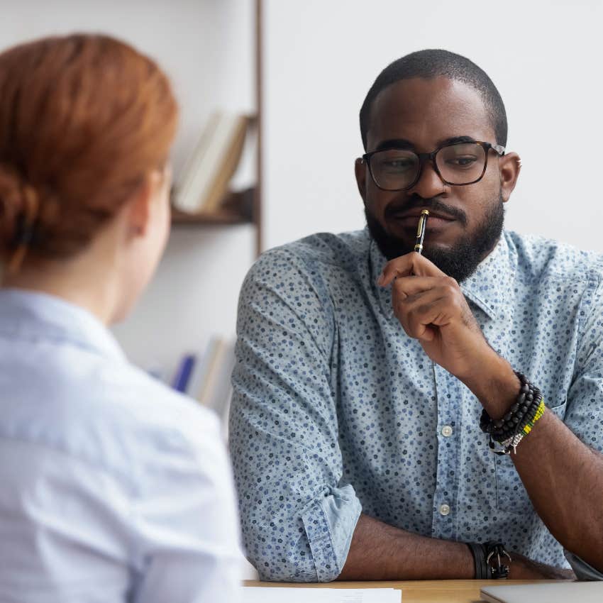 man thinking while in job interview with recruiter