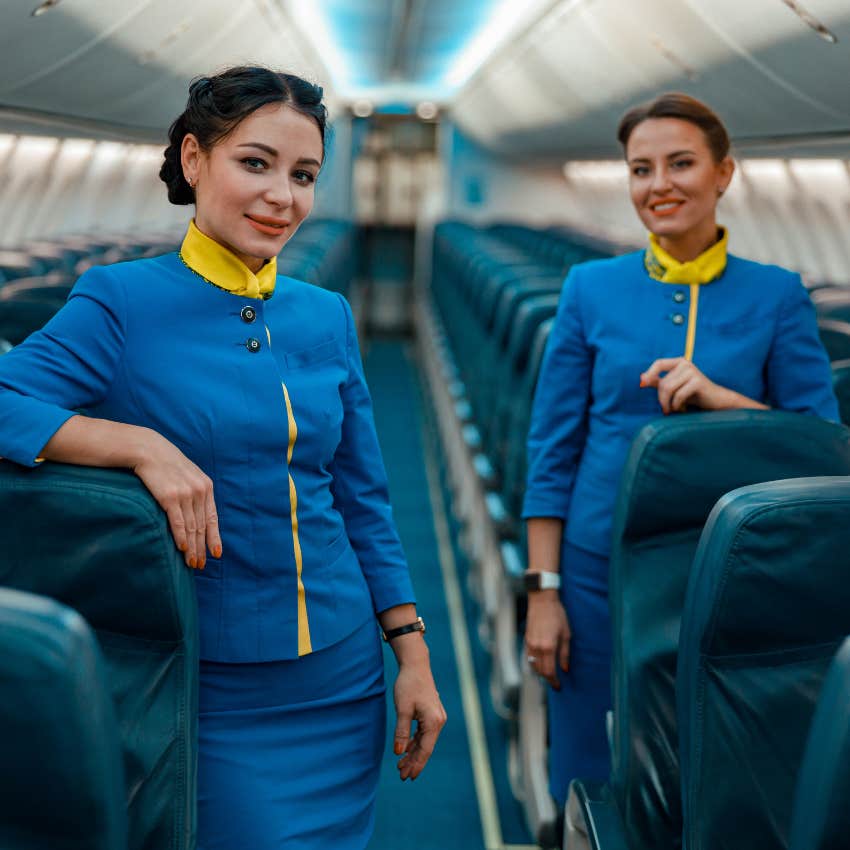 flight attendants standing on empty plane