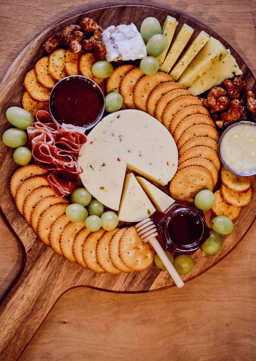 cheese spread on a wooden plate