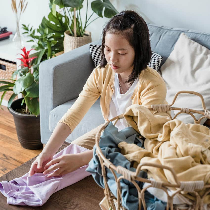 woman folding laundry