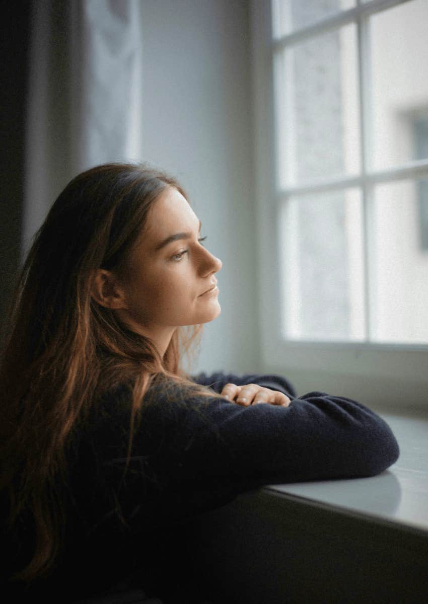 contemplative woman sitting alone