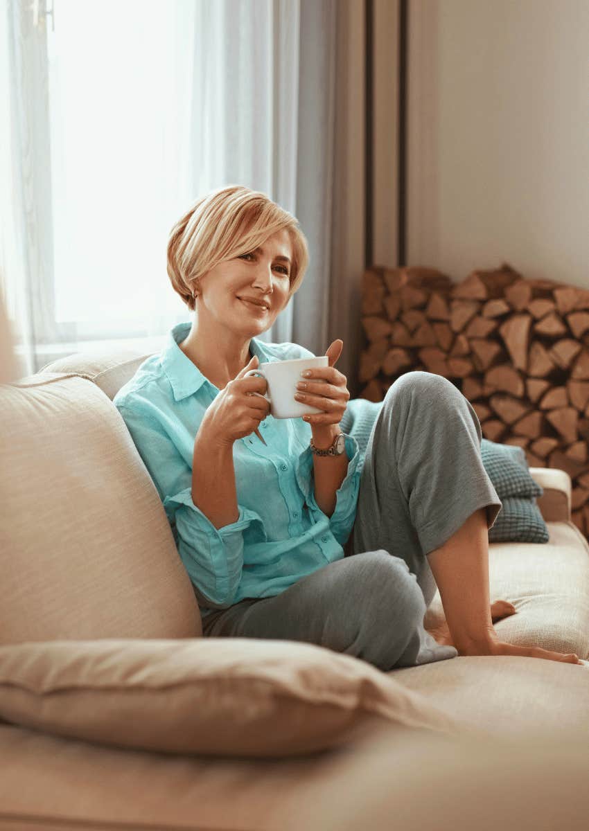 content mature woman relaxing on her couch