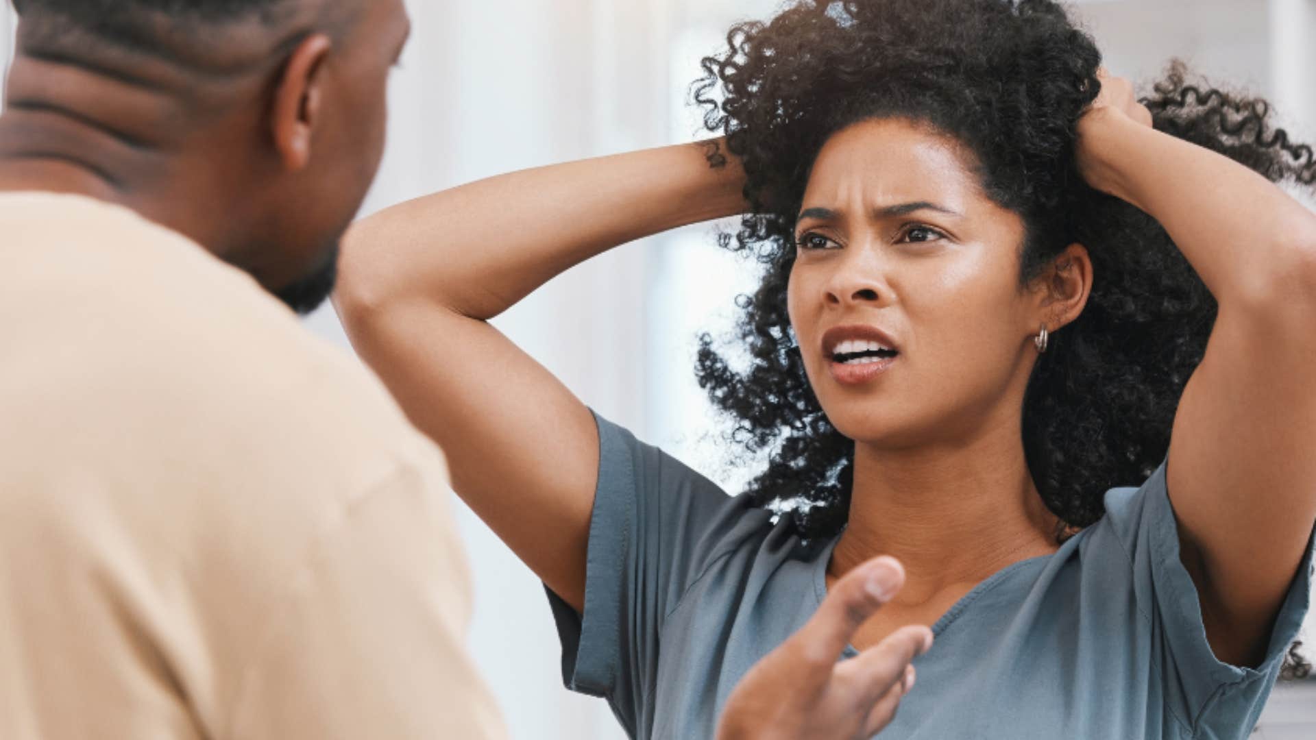 Controlling woman looks frustrated with a man she wants to manipulate