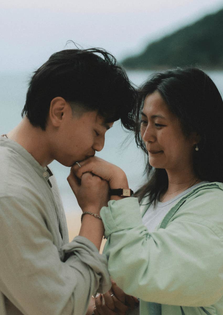 couple in a tender moment holding hands