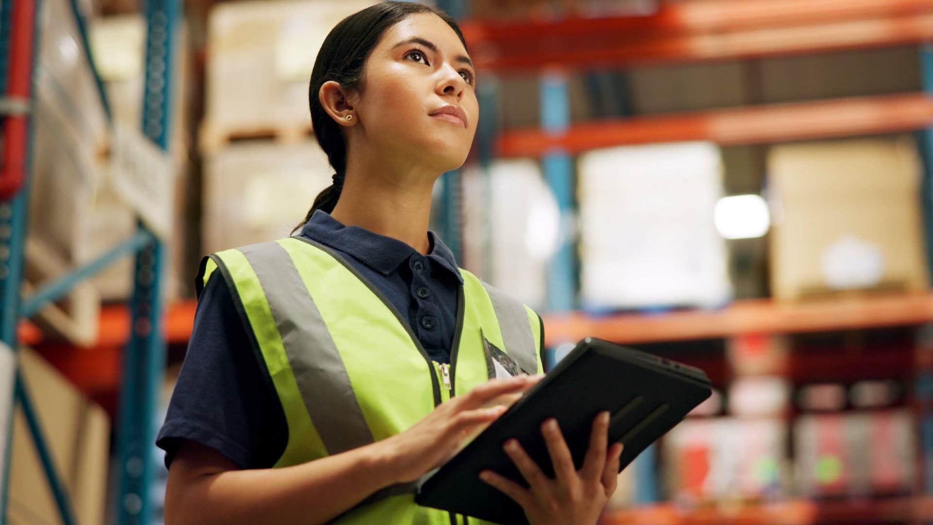 disciplined young woman working in a warehouse