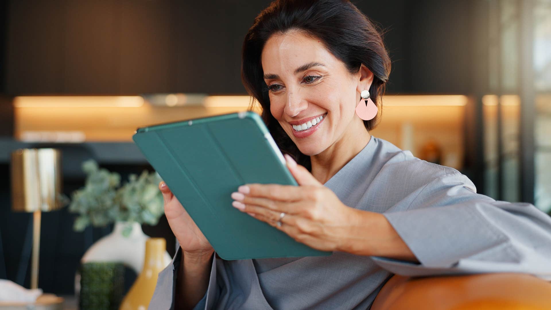 woman handling her obligations working on ipad
