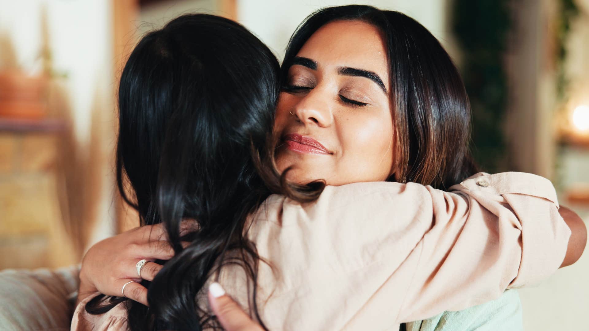reliable and supportive woman hugging her friend