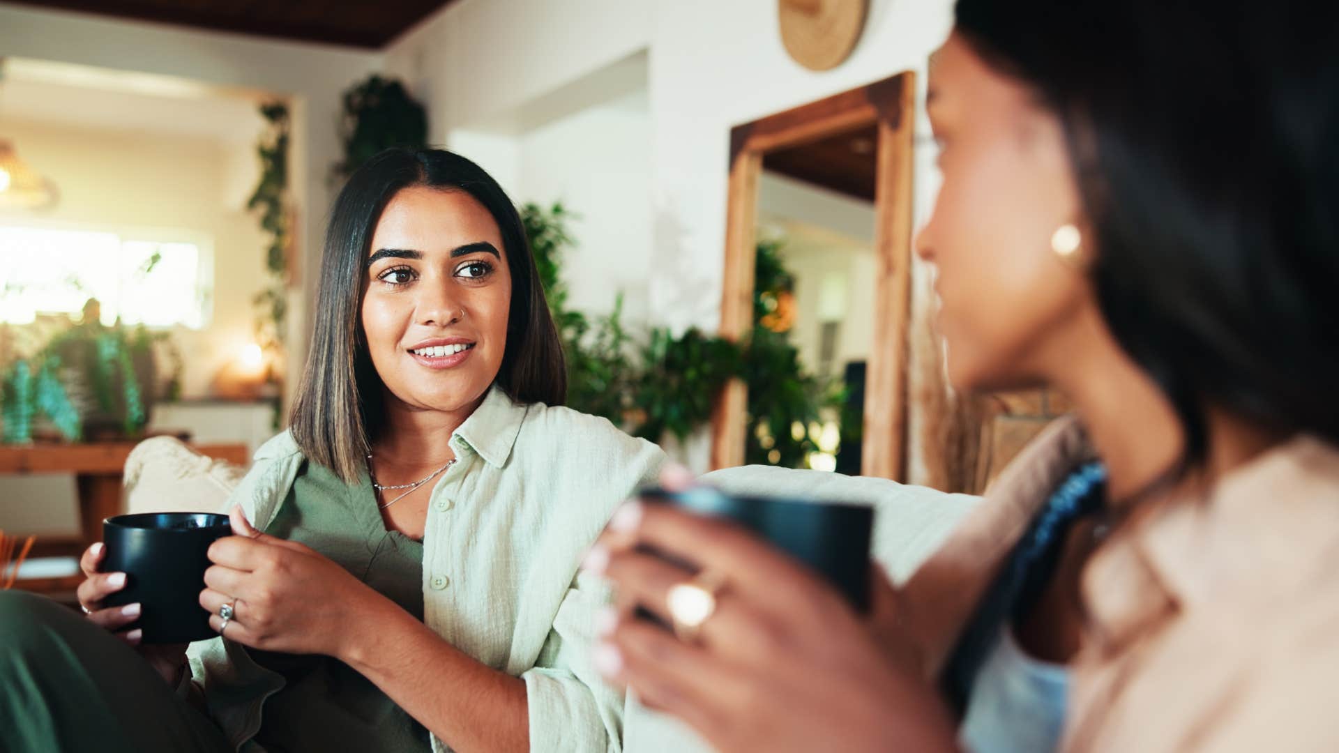 woman having coffee telling friend no offense but over coffee