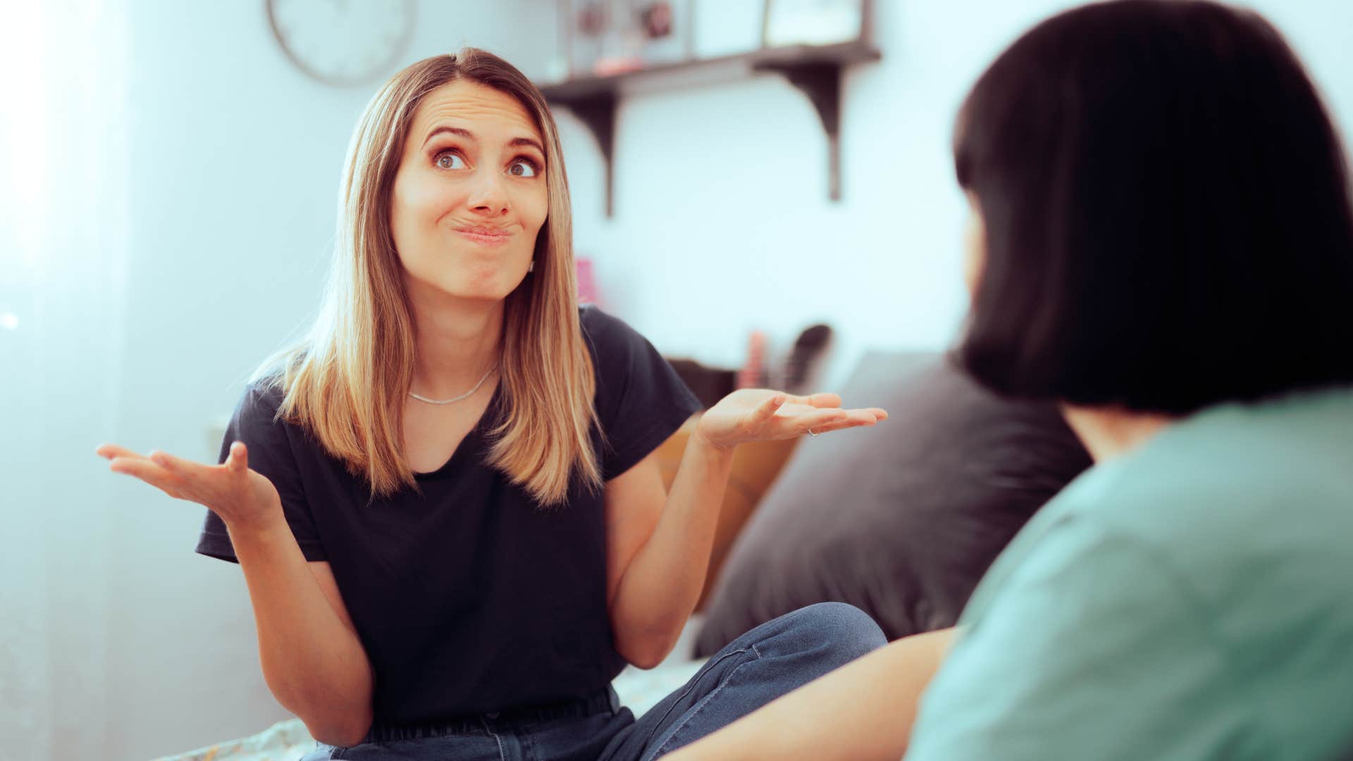 fake woman shrugging telling friend not my problem
