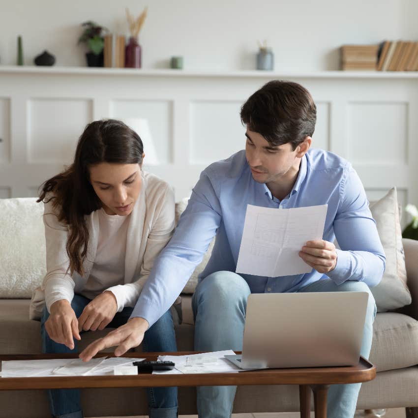 couple paying bills at home