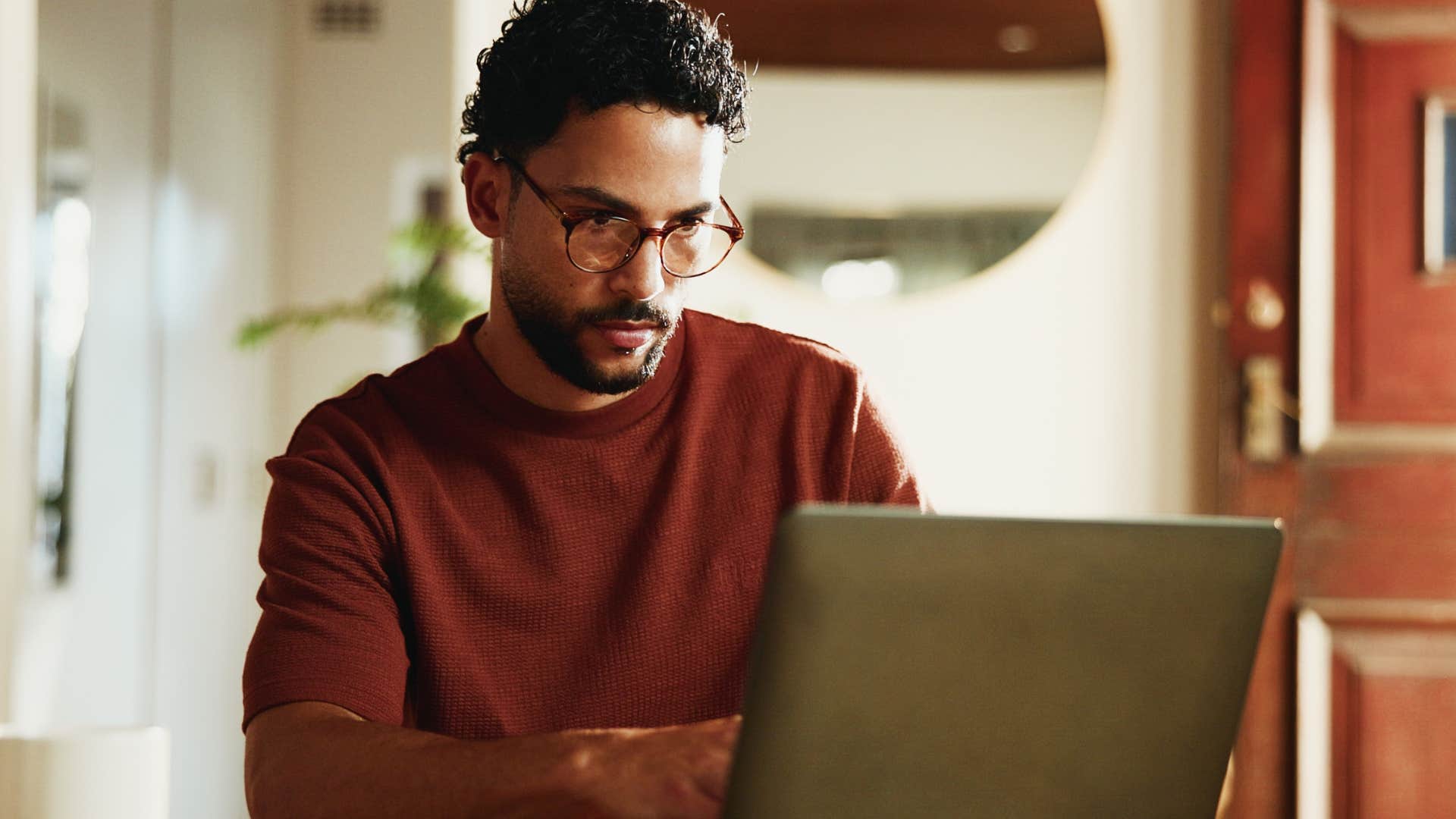 professionally creative man working on his laptop