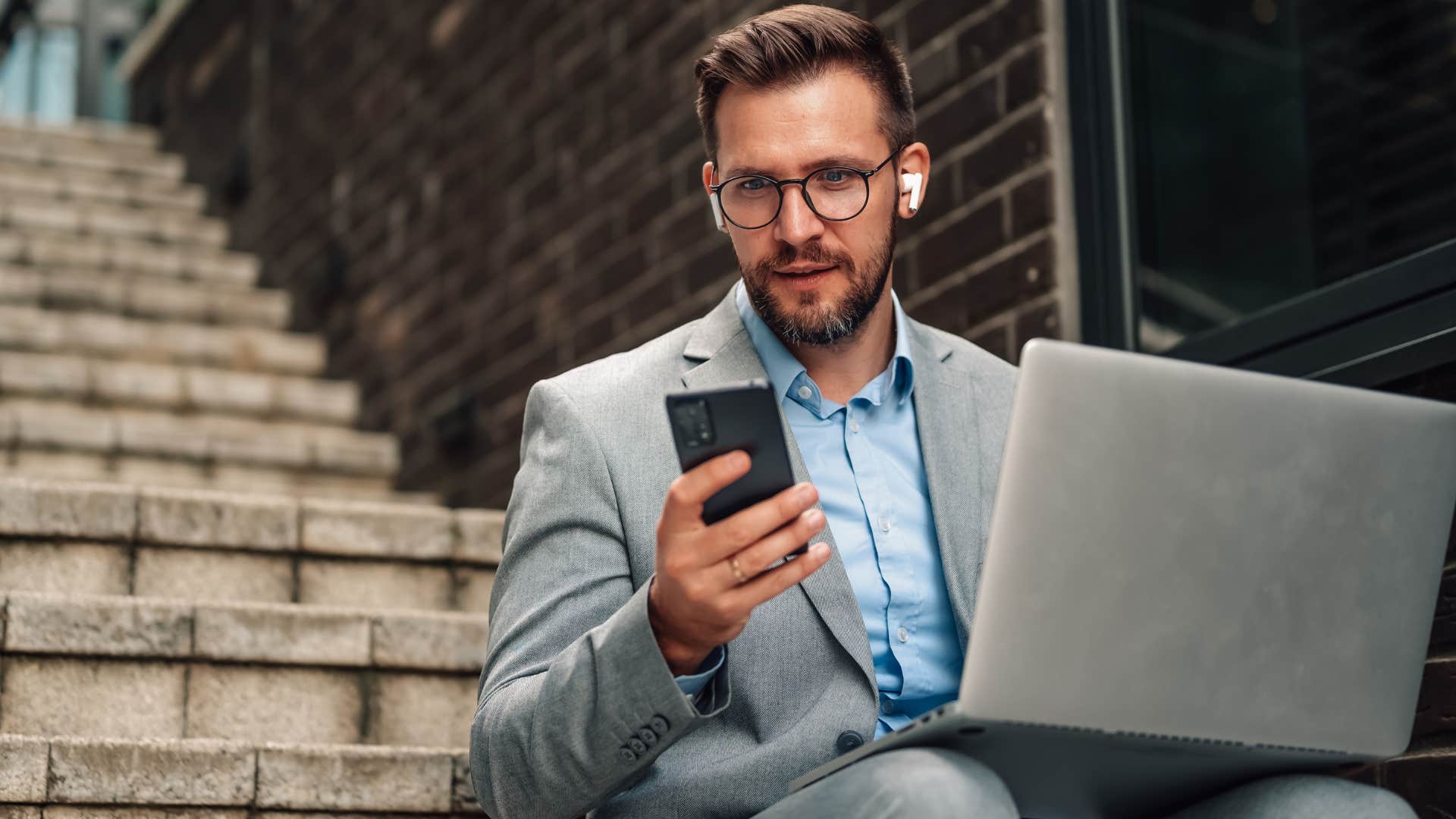 man who's an honest self-starter working outside on laptop