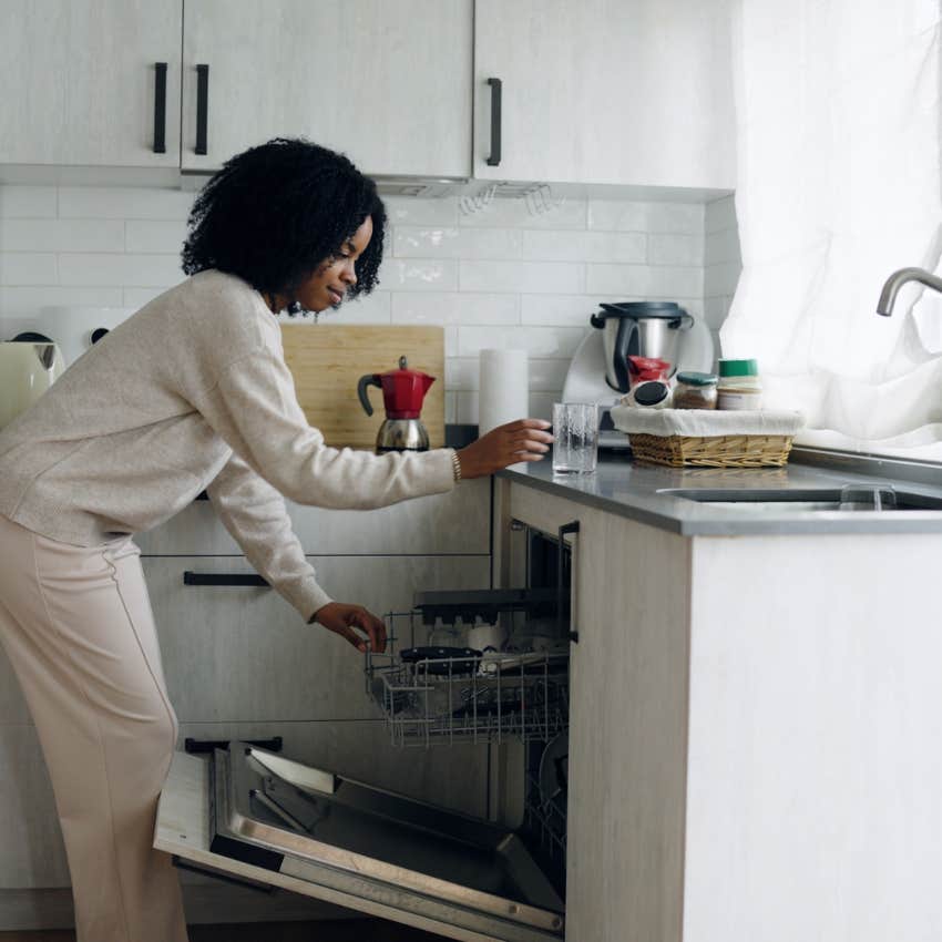 woman cleaning kitchen loading dishwasher working clockwise around the room