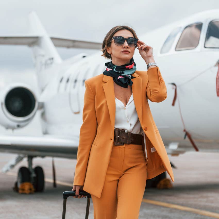 woman business owner flying private jet earns a lot of money and has a good amount of free time