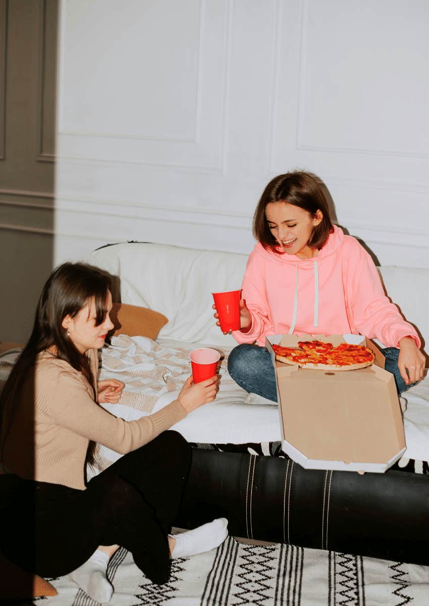 friends sharing pizza during girls night