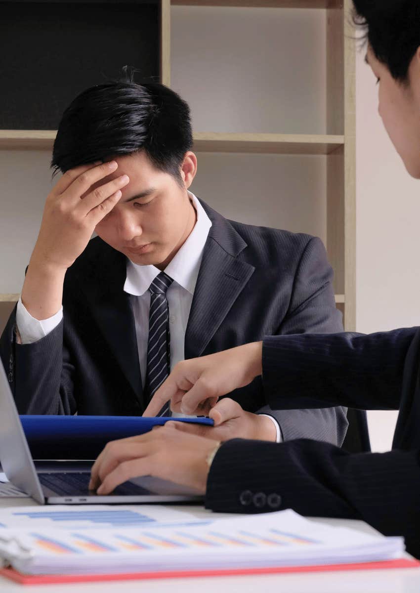 frustrated worker having a meeting with his boss