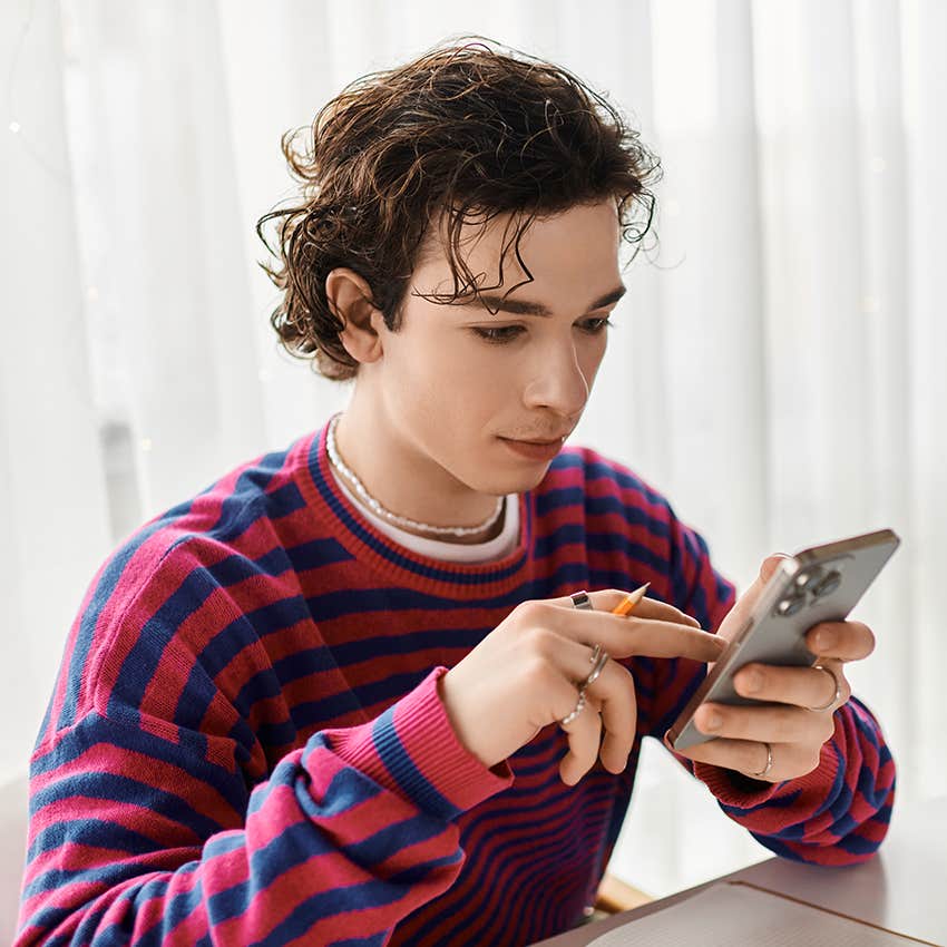 teenager texting on phone casually