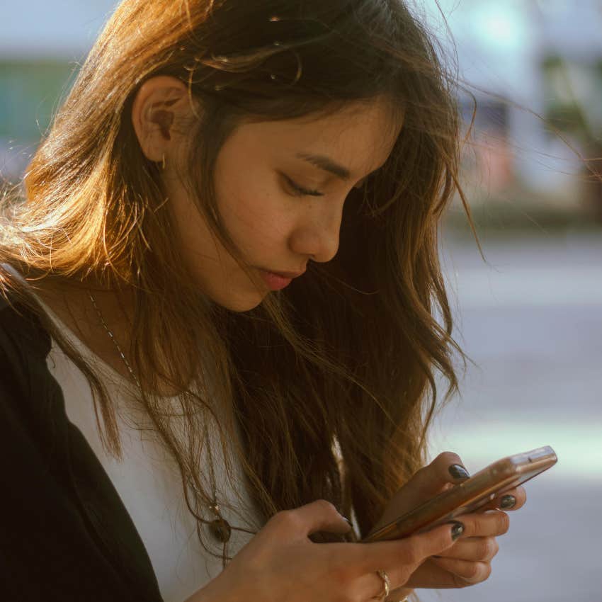 gen z young woman texting in lowercase to convey causal tone