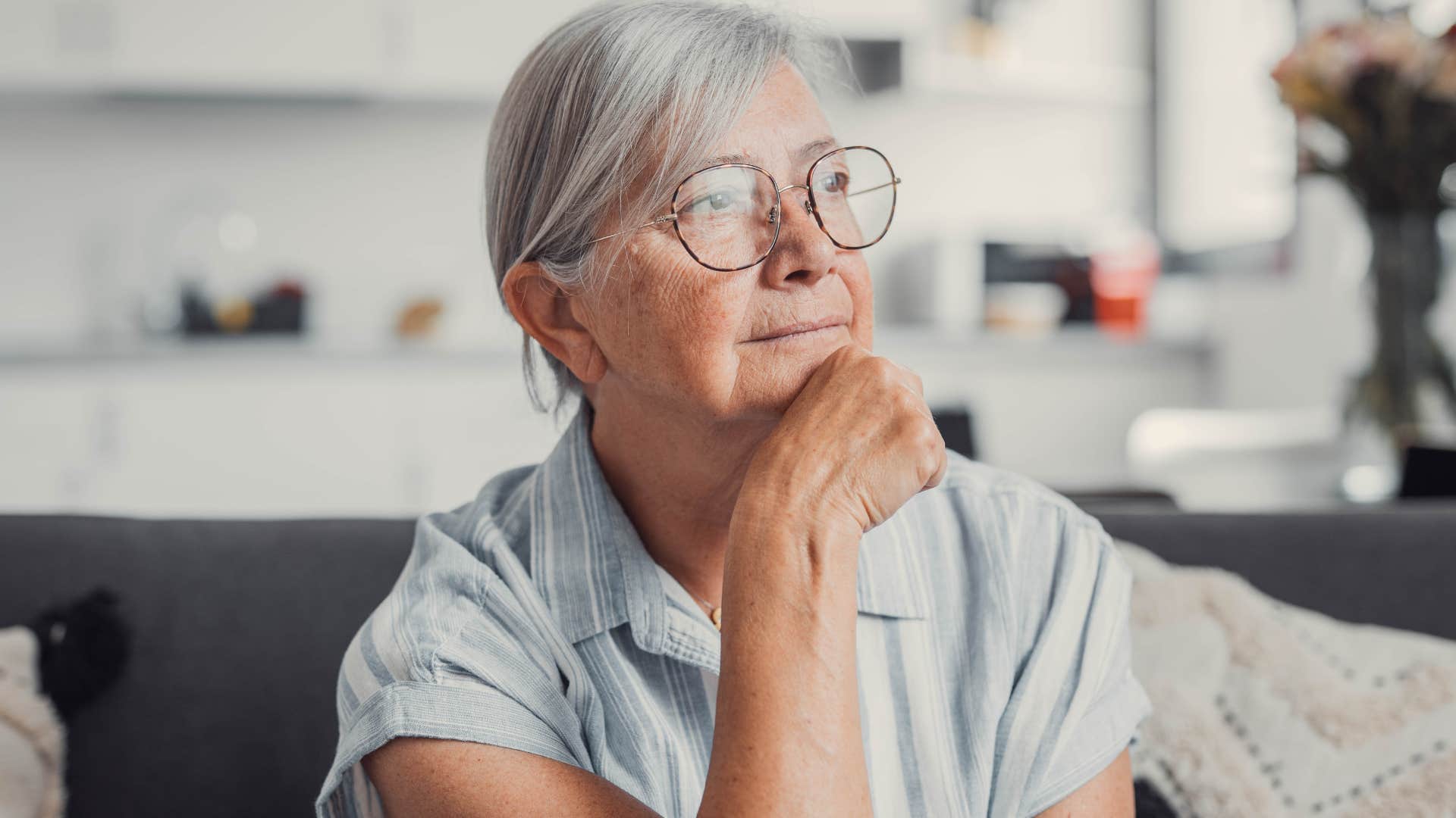 sad older woman thinking I don't want to be a bother