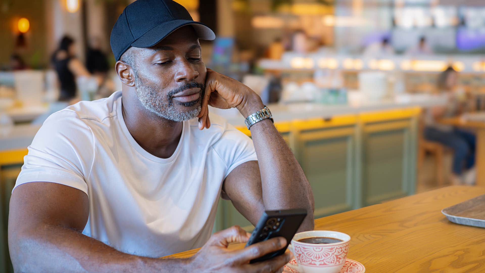 man who refuses to grow up looking following random women on his phone