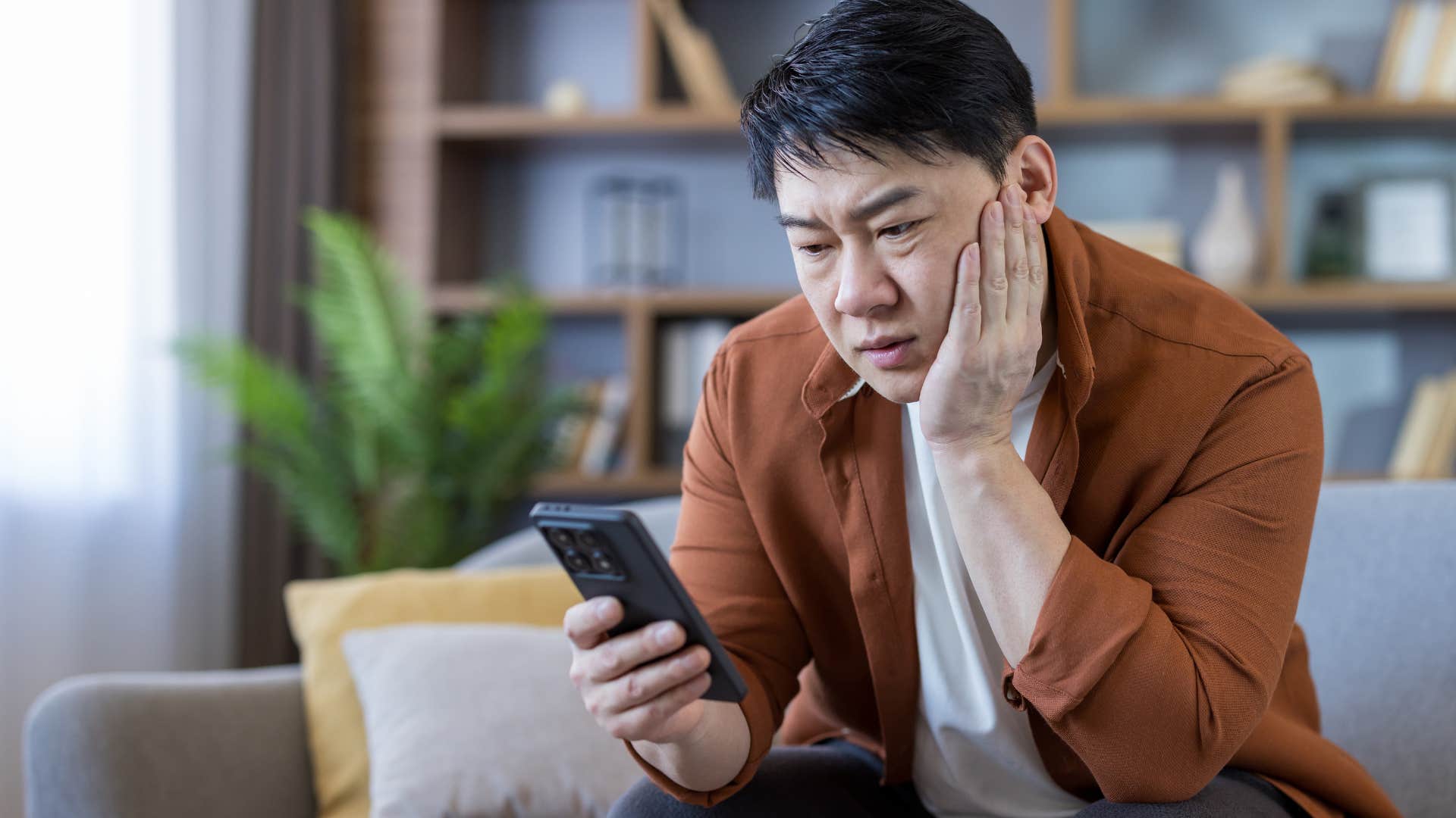 man seeking instant gratification through social media on his phone