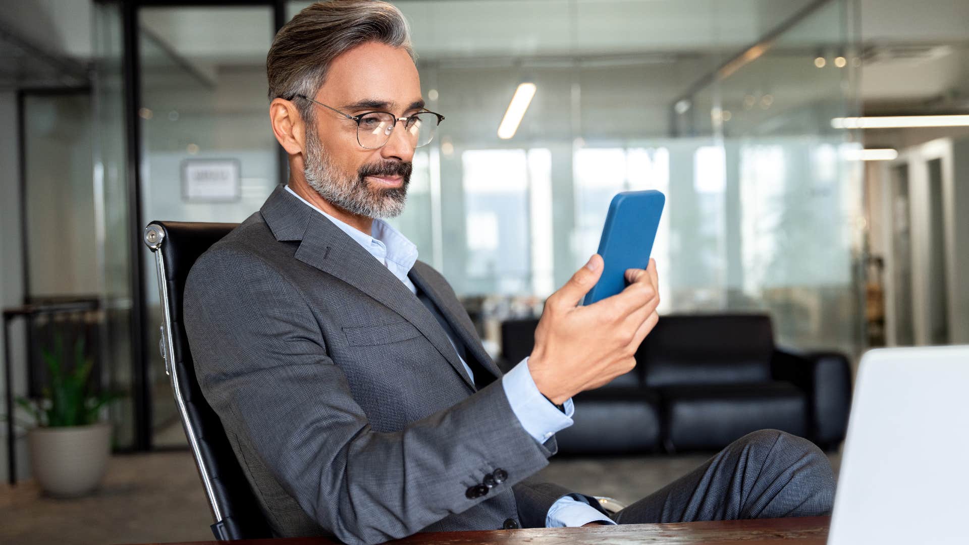 man at work using social media to distract from obligations