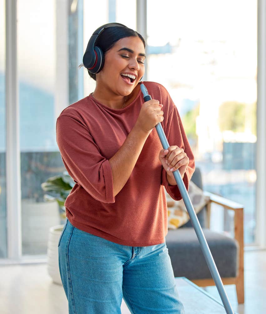 happy person sings while cleaning house