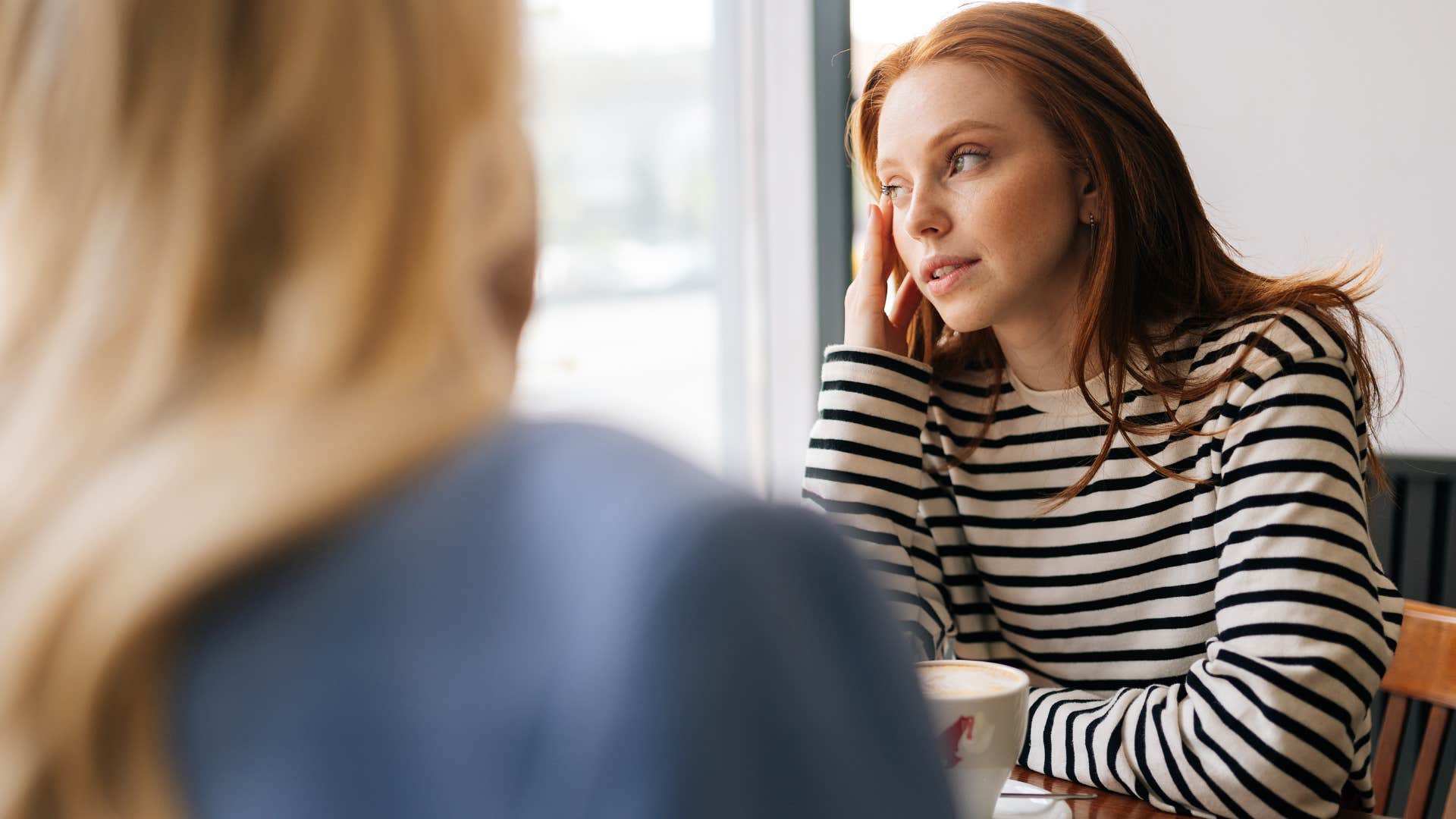 truly special woman feeling bored by friend's gossip