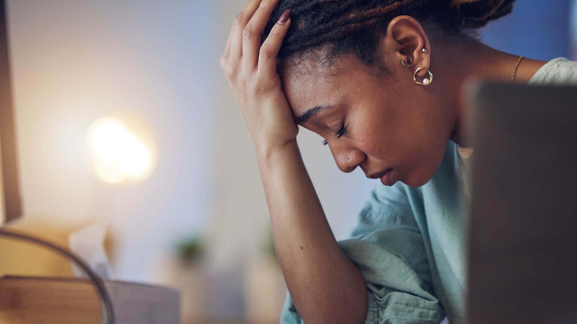 frustrated woman staying busy to avoid solitude at home