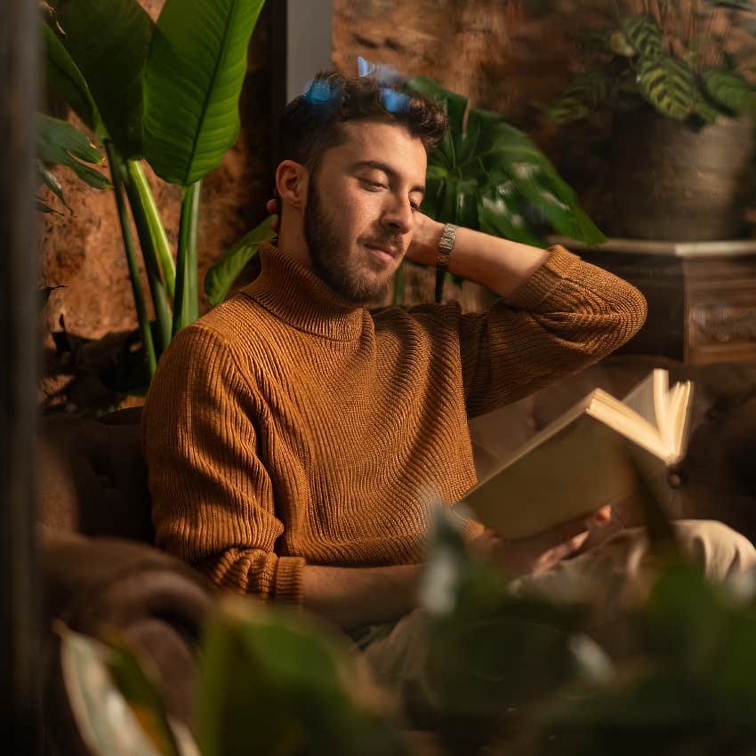 intelligent man reading book alone