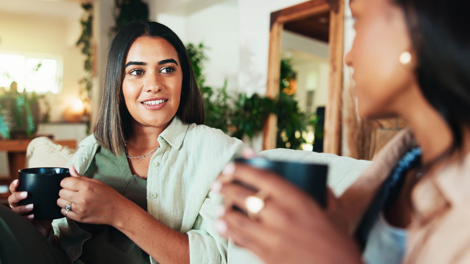 happy woman who doesn't overexplain their choices speaking to a friend