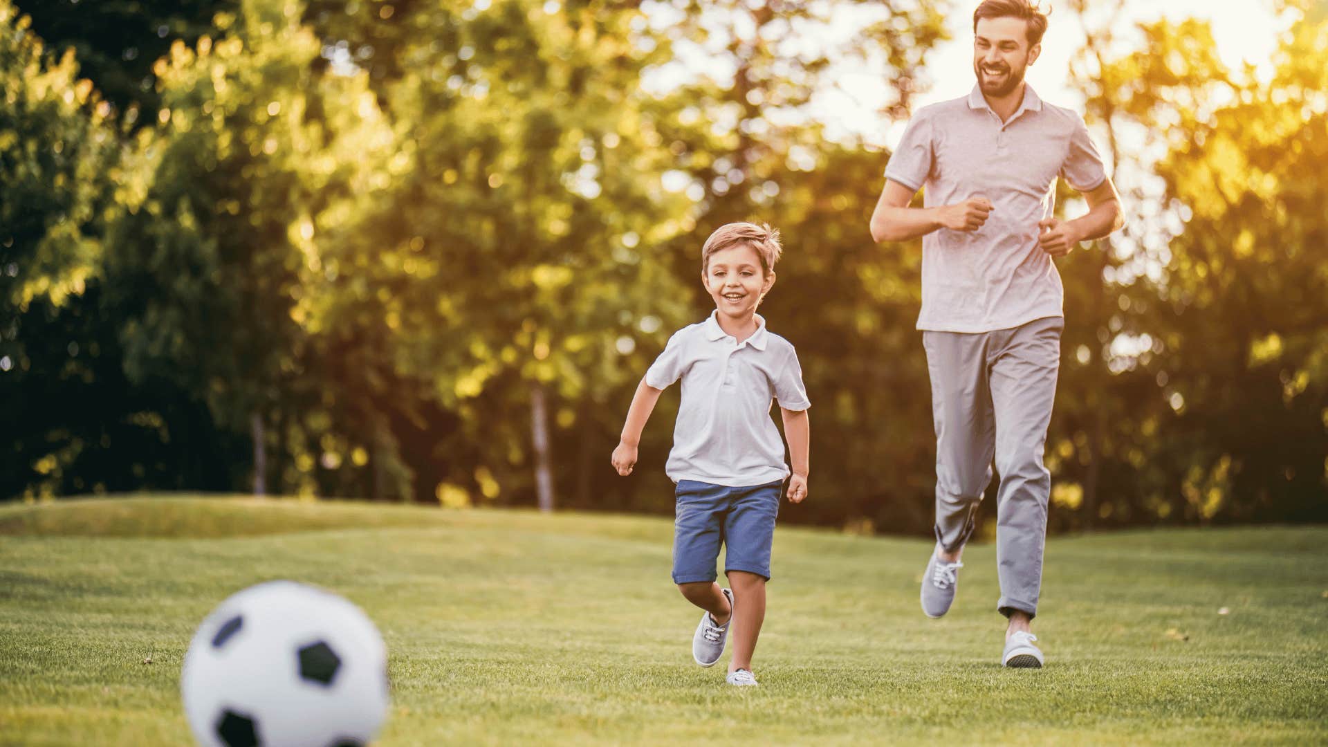 helicopter parent running with child at park