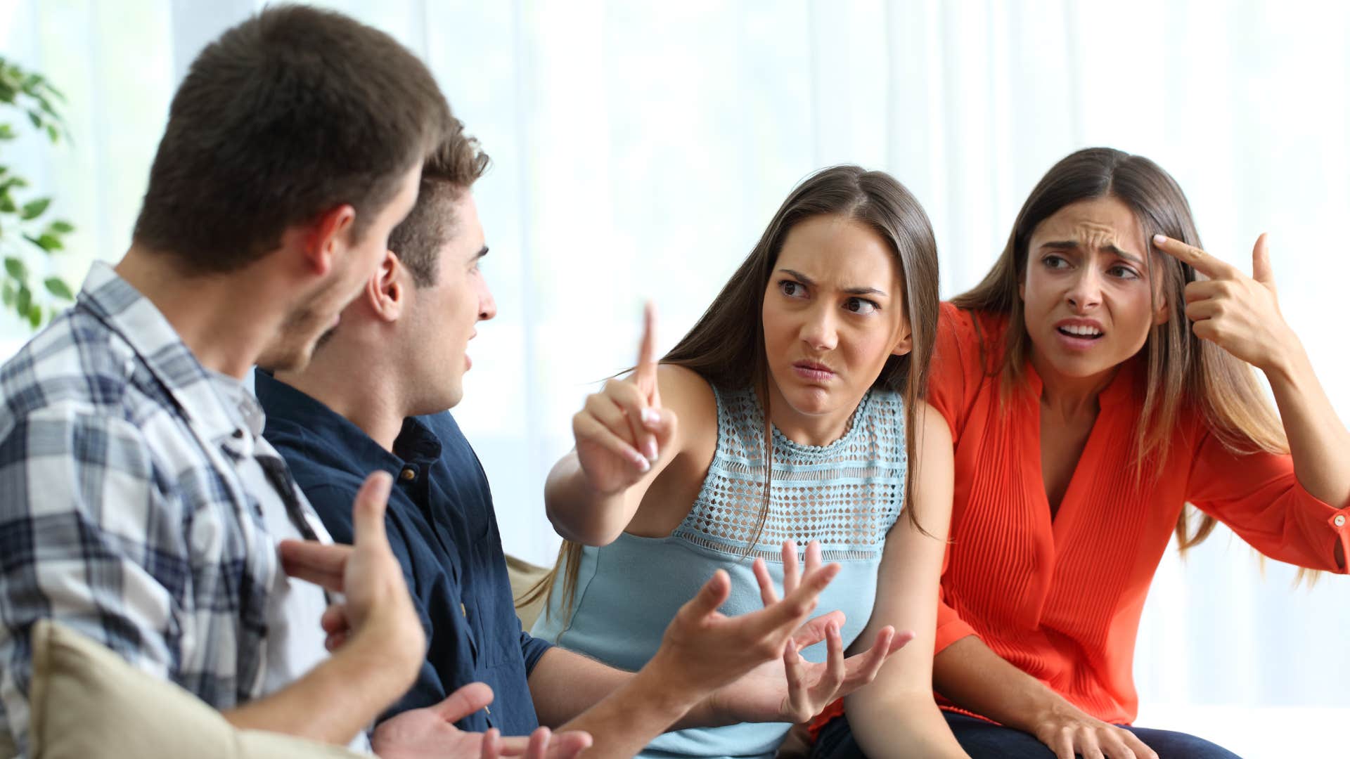 woman scolding condescending men with her friend