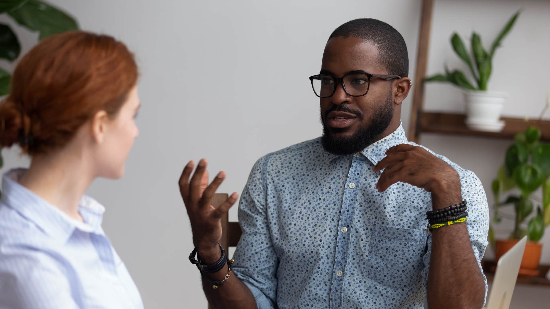 man calmly telling condescending colleague to talk to each other not at each other