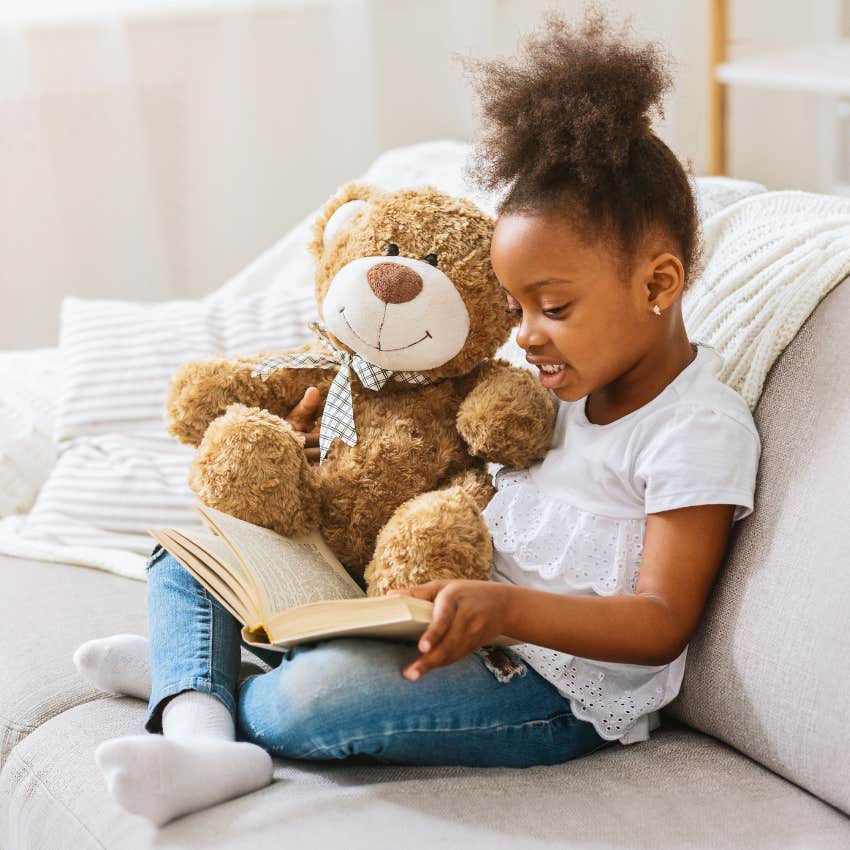 little girl reading to her teddy anthropomorphism used to be considered childish