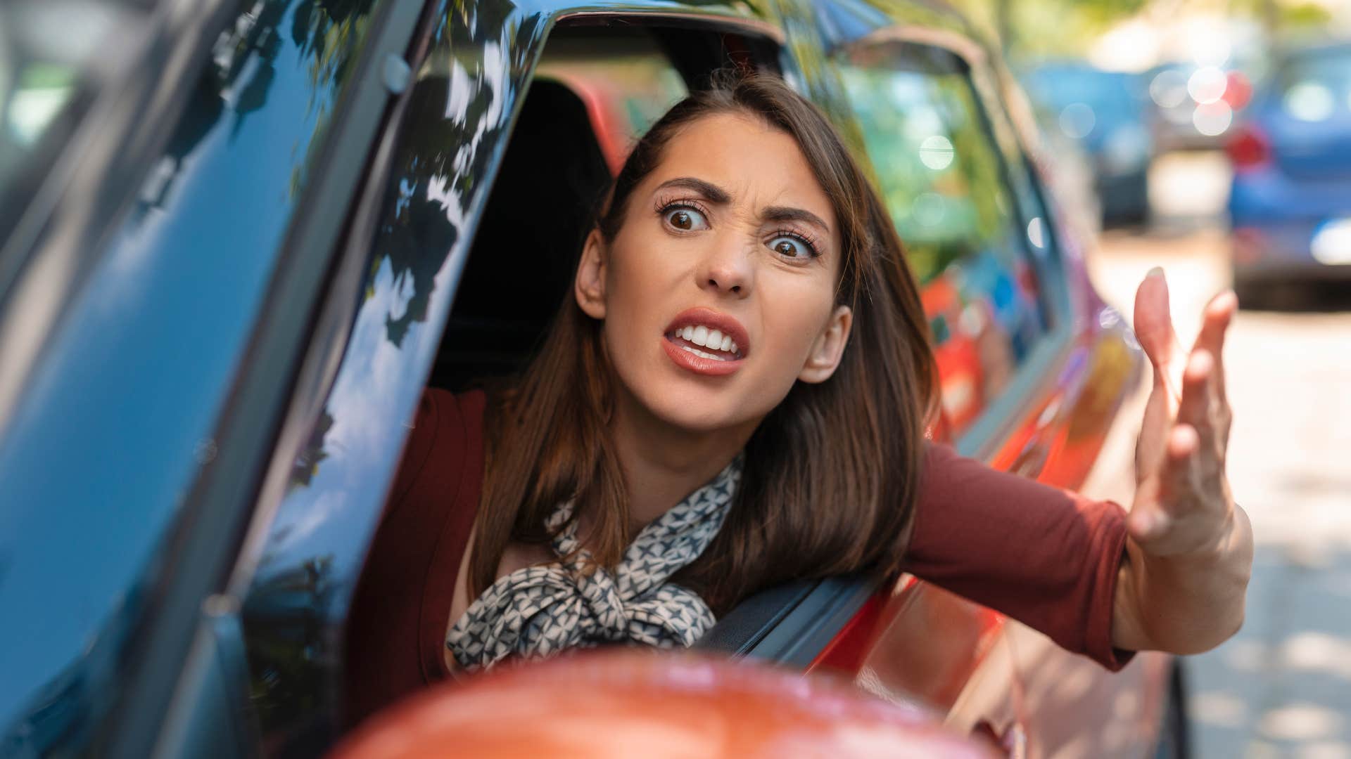 woman with road rage showing inconsiderate behavior