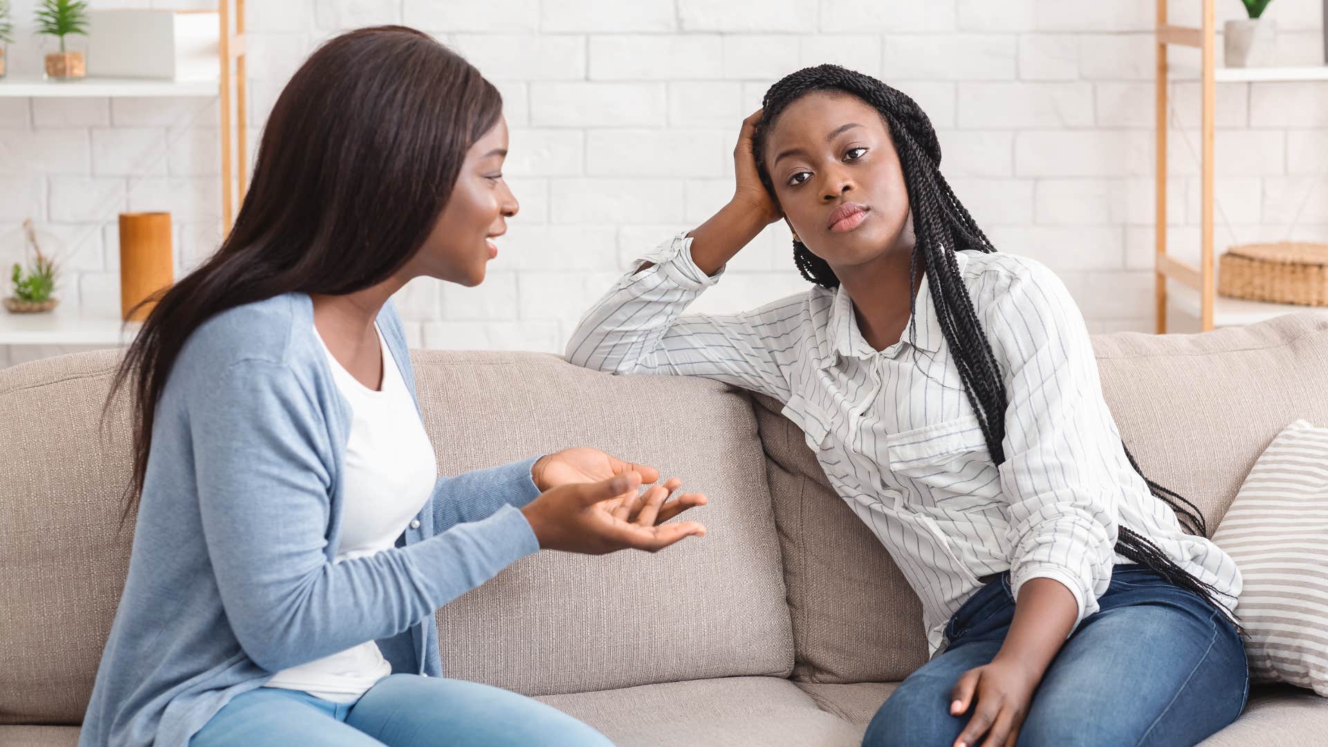 high iq woman feeling annoyed by surface-level conversation with friend