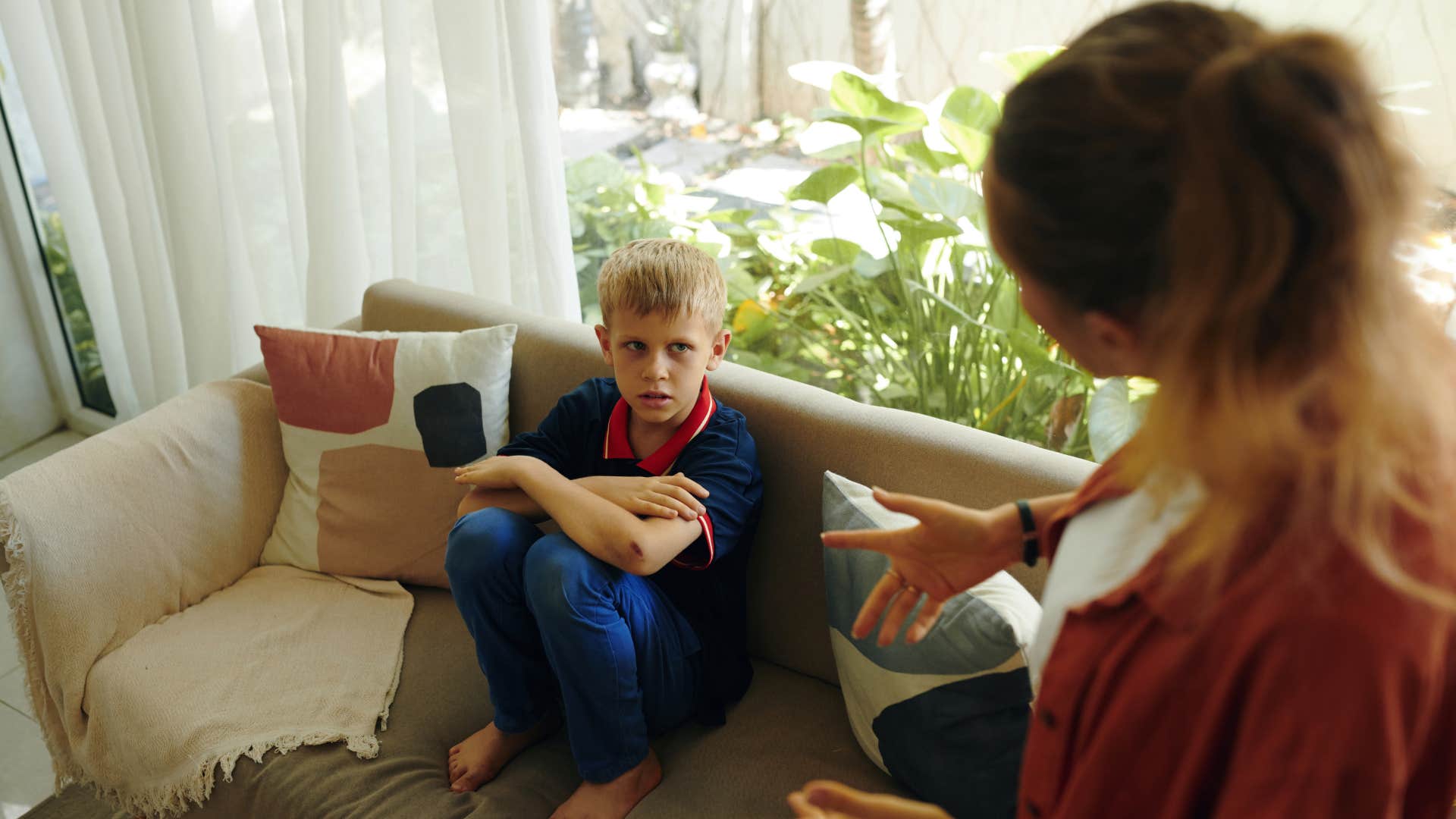 mom calmly telling upset son we can talk about it raising him to be intelligent