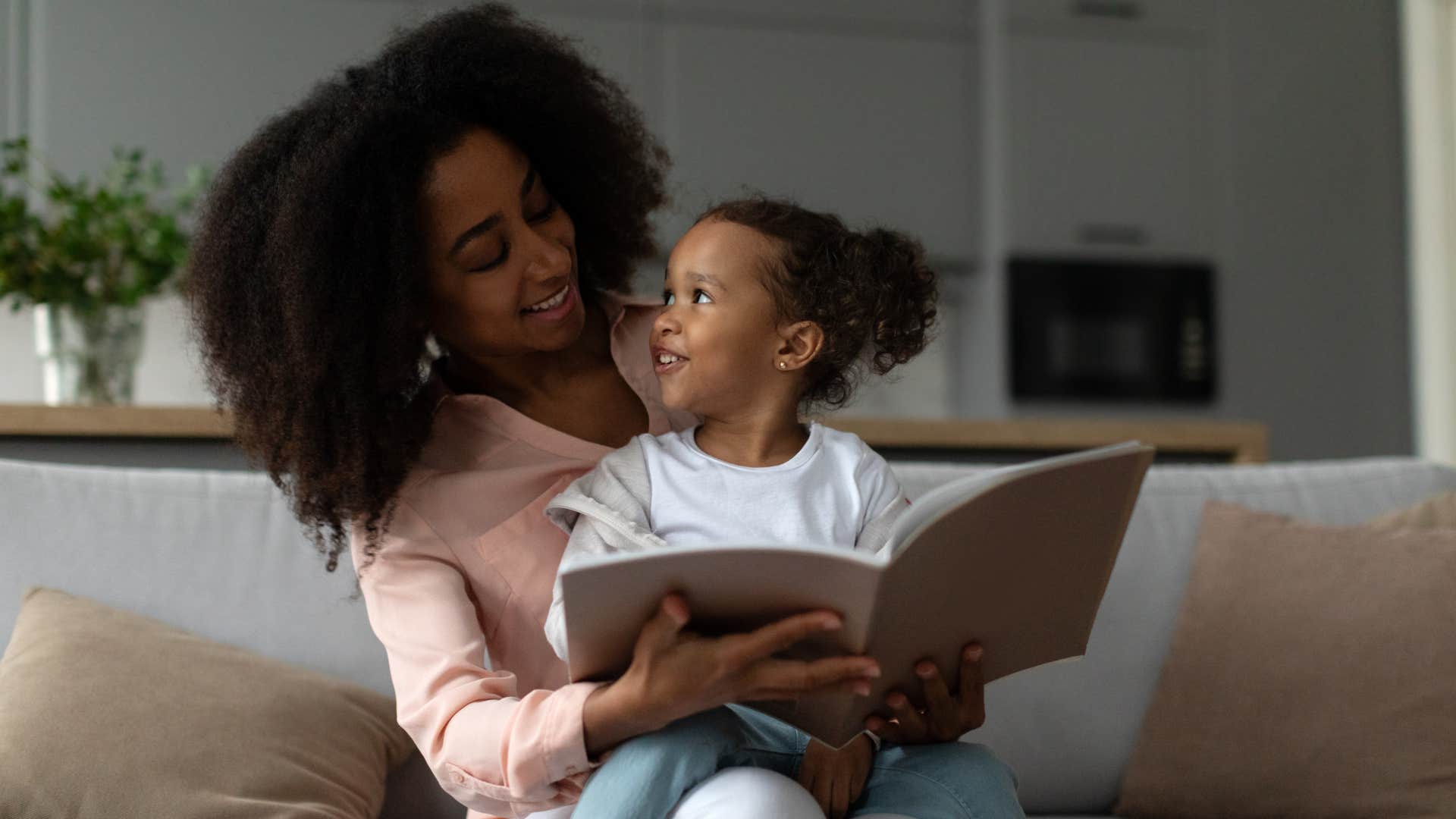 mom reading to her daughter asking what does that mean