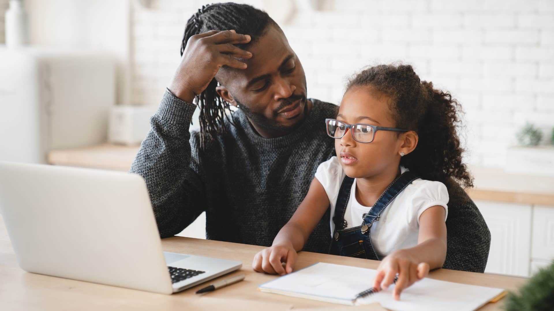 dad telling intelligent daughter you're allowed to make mistakes helping with homework