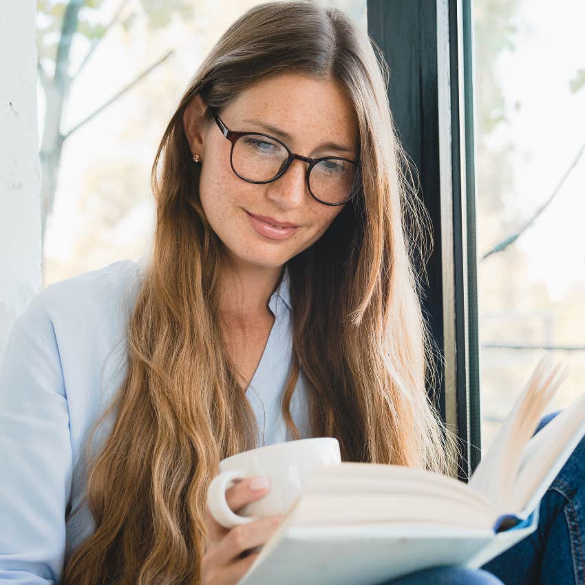 highly introverted woman reading at home 