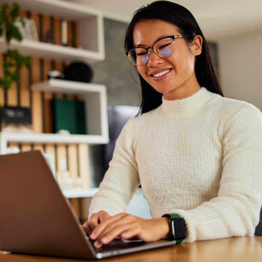 happy woman writing in chatgpt for help