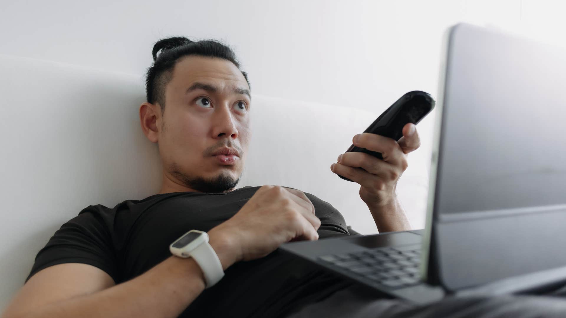 man with unhealthy coping skills watching tv 